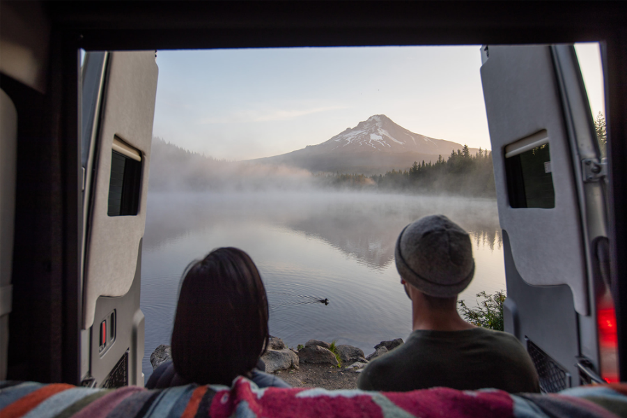 Couple enjoying the view from their RV.