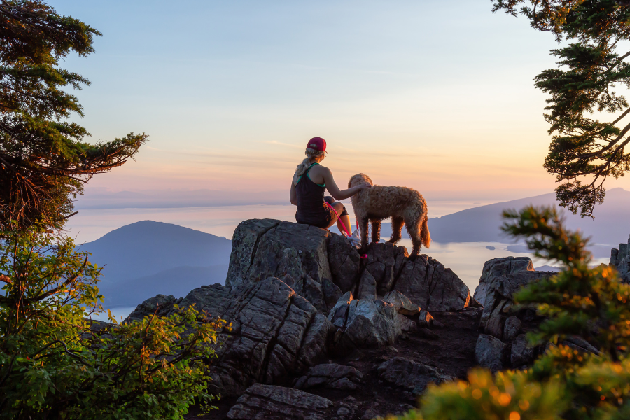 women hiking with dog 
